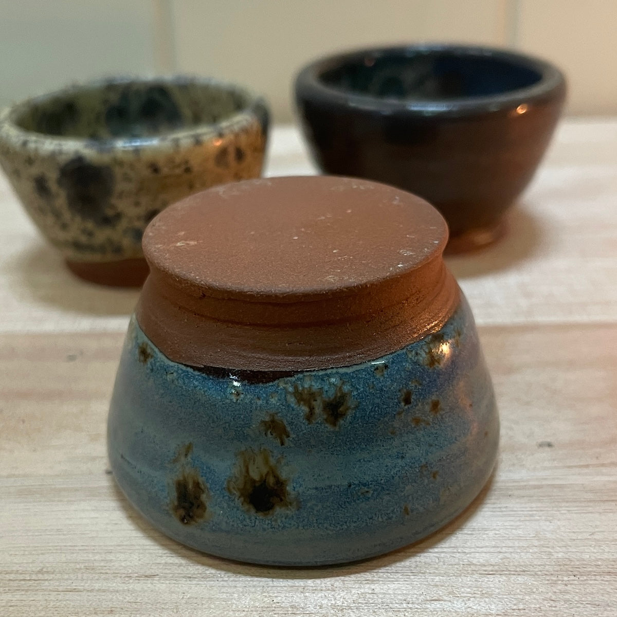 Dark clay base Beeswax ceramic candle holder from Happy Flame