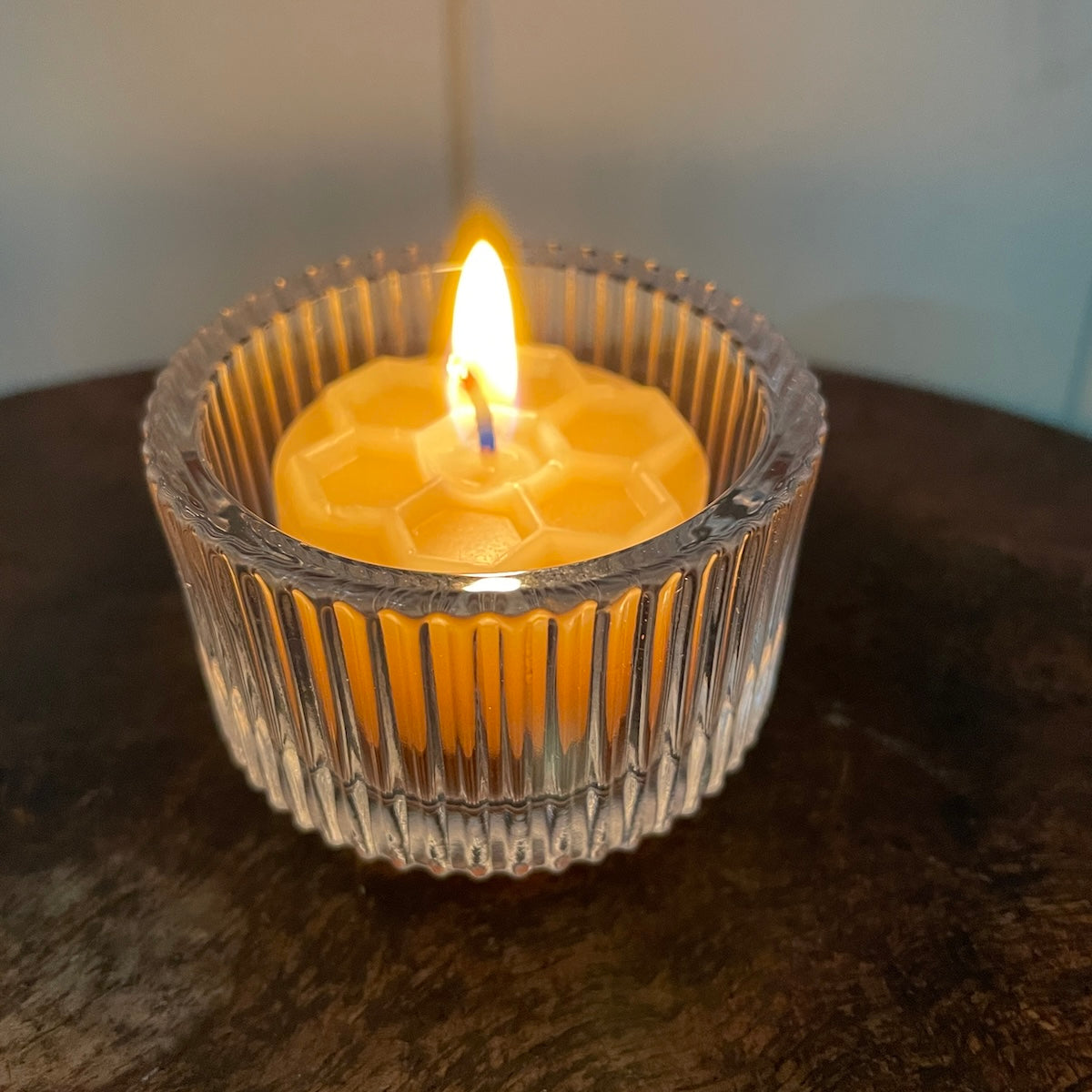 Honeycomb beeswax candle in ribbed glass holder by Happy Flame