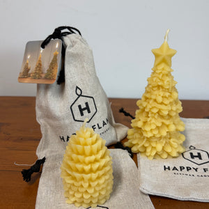 Two Beeswax Christmas tree candles with a beeswax pine cone candle