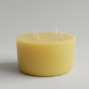 Beeswax candle with four candle wicks.