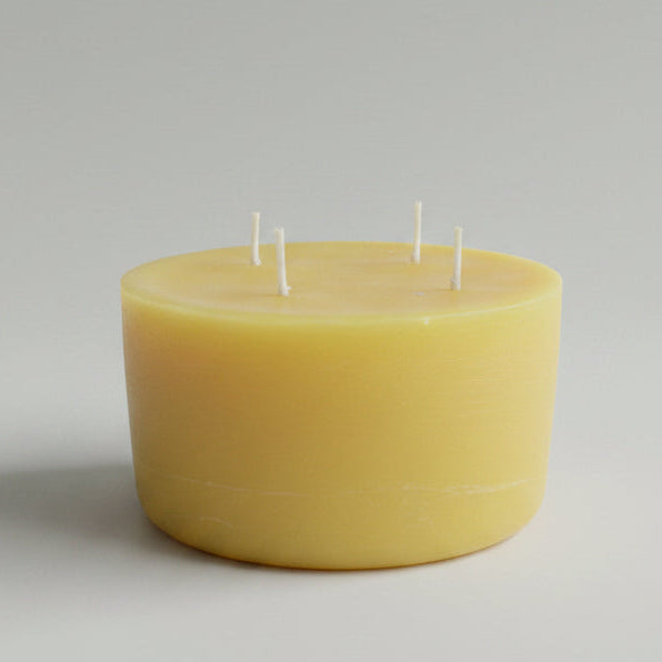 Beeswax candle with four candle wicks.