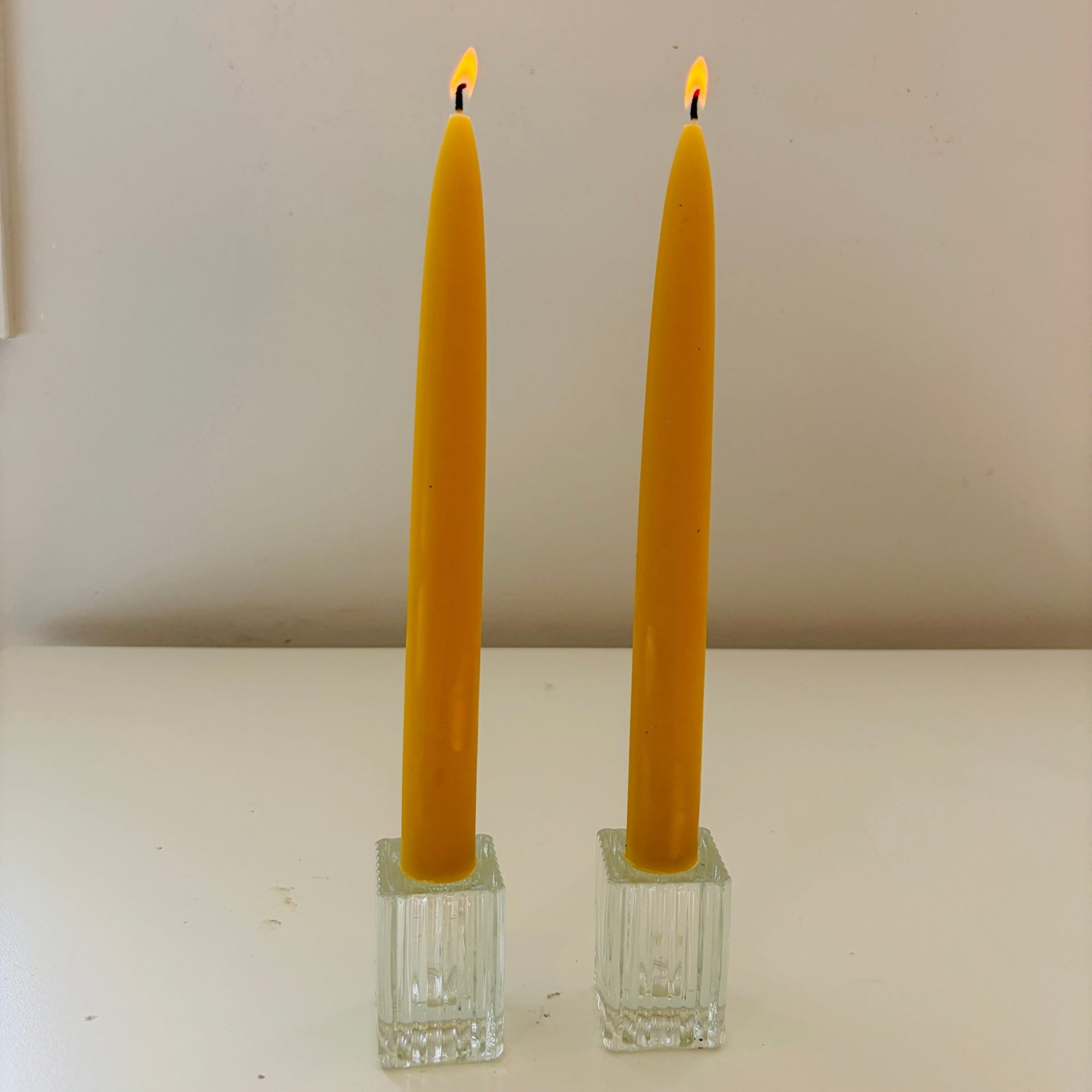 Beeswax traditional taper candle in glass holders