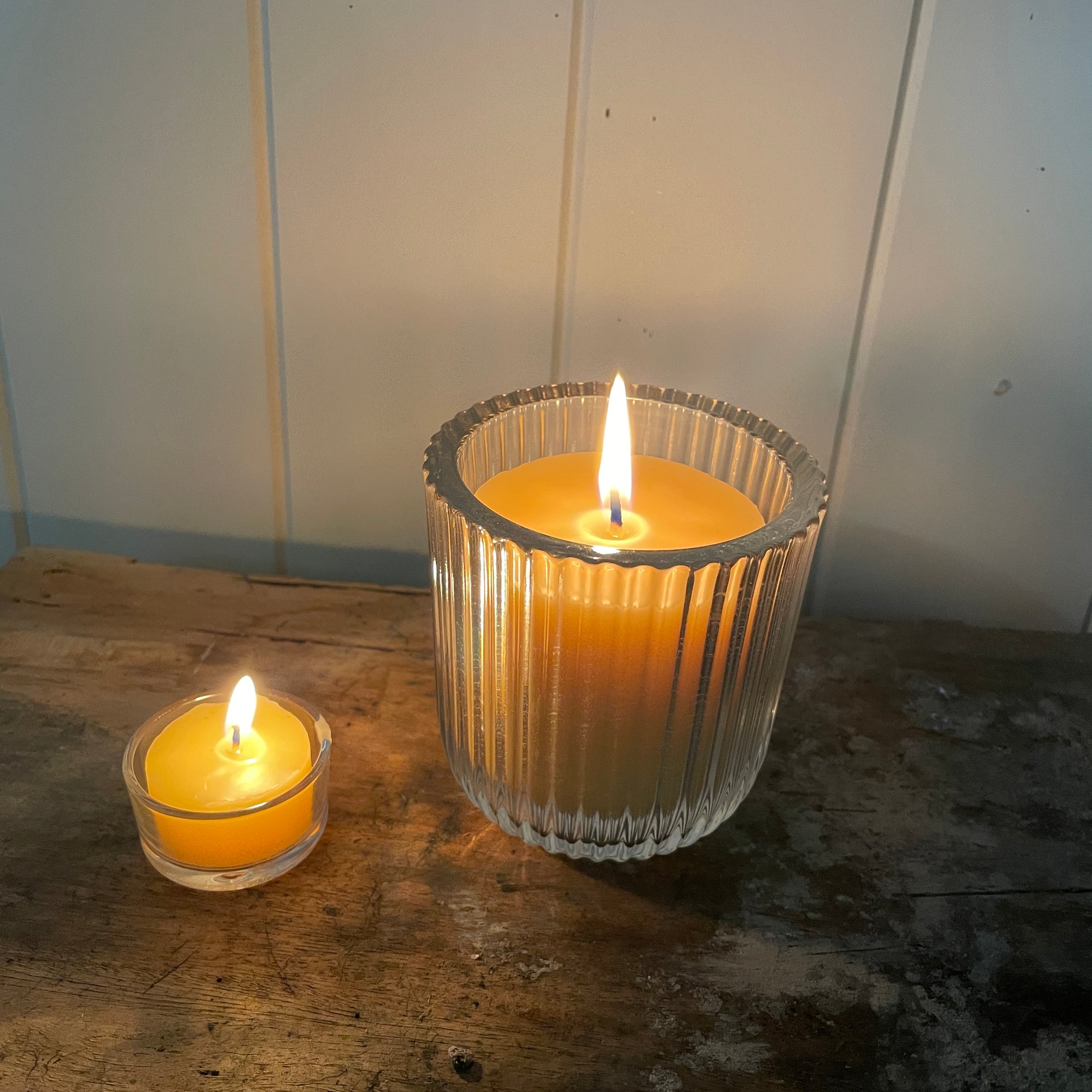 Beeswax candle in a ribbed glass holder from Happy Flame