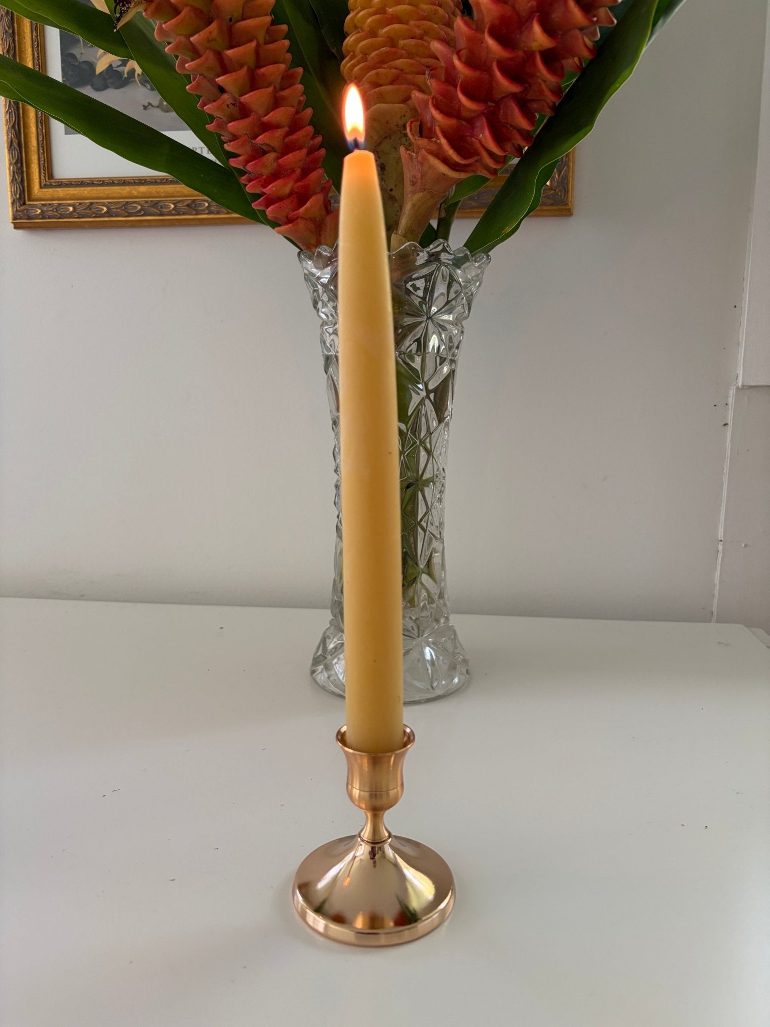 Metal candle stick holder with beeswax candle