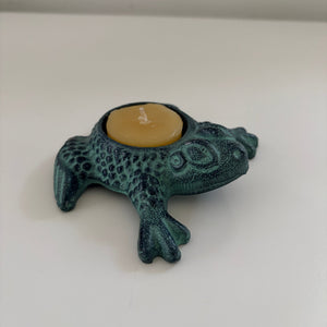 Metal frog candle holders with Antique finish holding a candle- Happy Flame