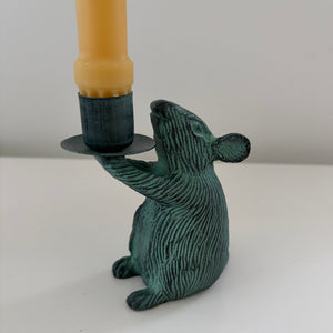 Metal mouse shaped candle holders with Antique finish holding a candle- Happy Flame