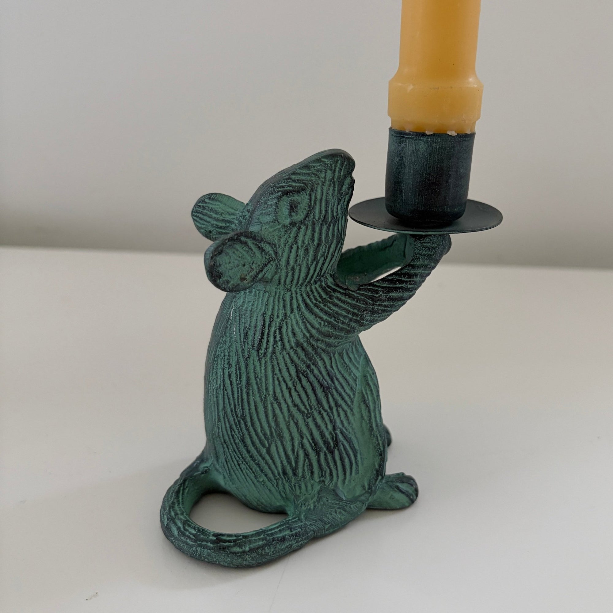 Metal mouse shaped candle holders with Antique finish holding a candle 2- Happy Flame