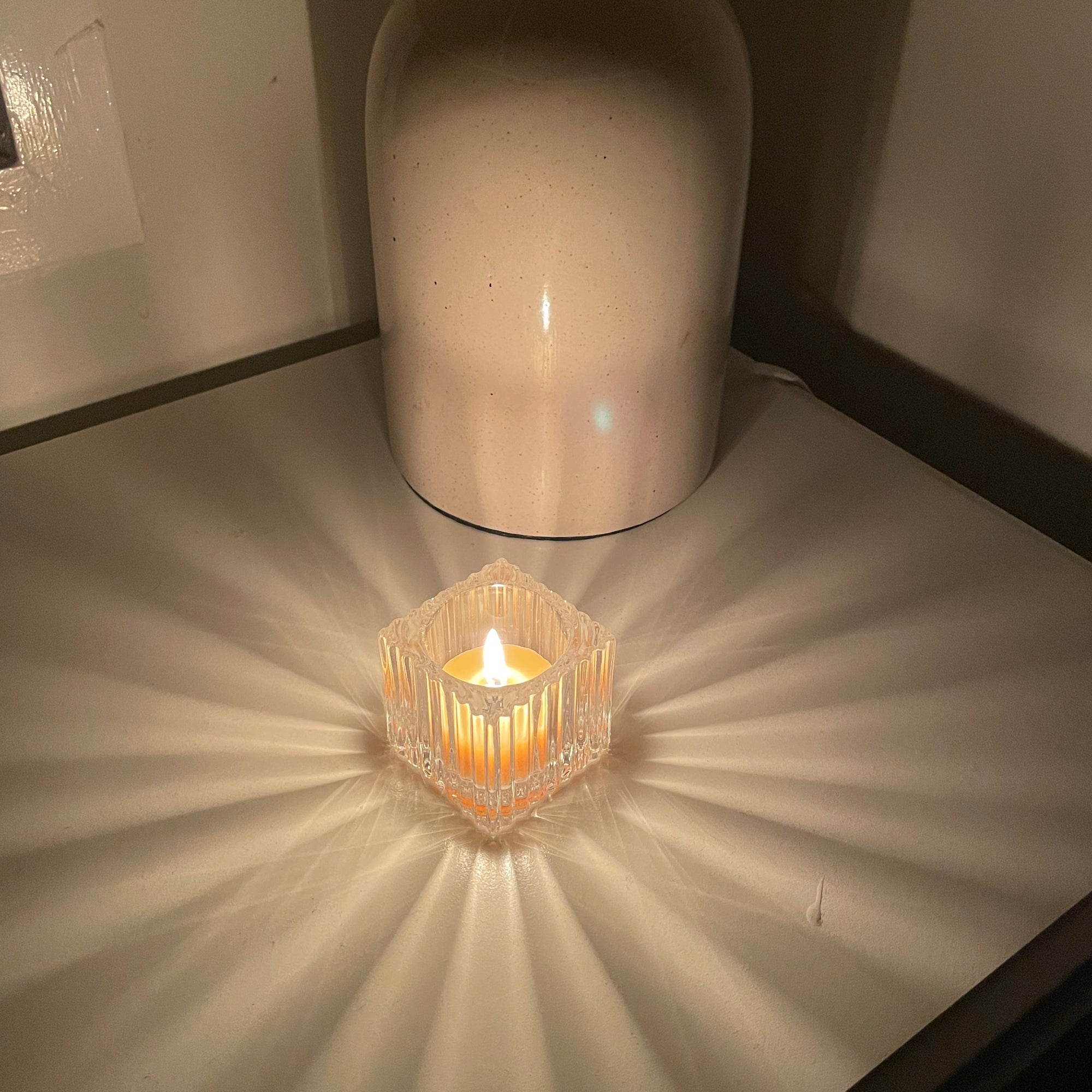 Square glass candle holder- ribbed decoration on the outside
